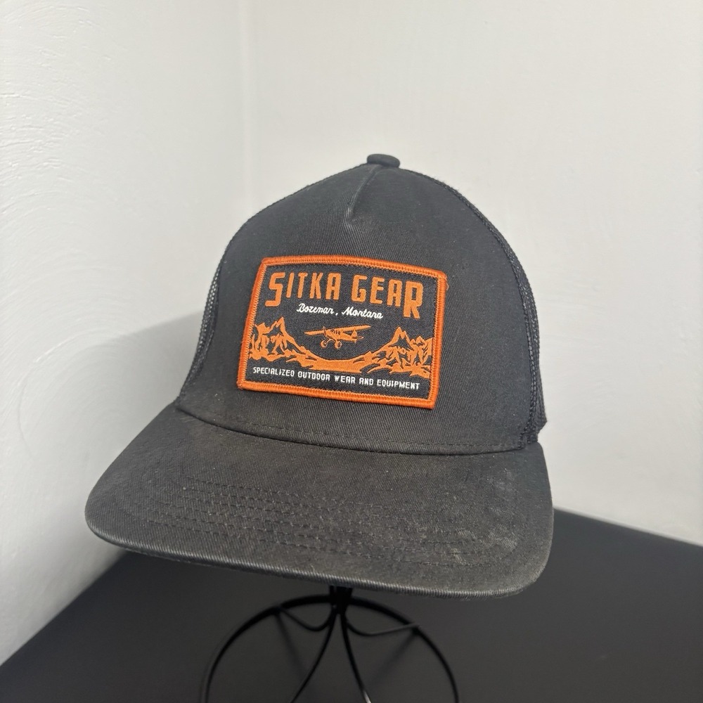 Sitka Gear Black Baseball Trucker Hat with Orange Patch